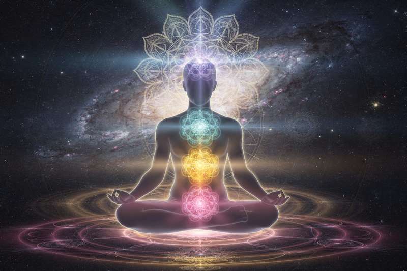 Seven colorful spinning energy wheels aligned vertically along the human body representing chakra centers.