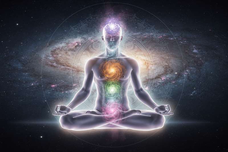 Beginner practicing guided meditation to align and balance the seven chakras throughout the body.