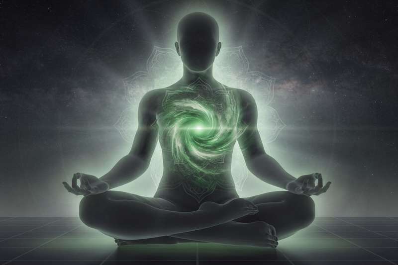 Person holding hands to chest experiencing emotional tension and disconnection from others.