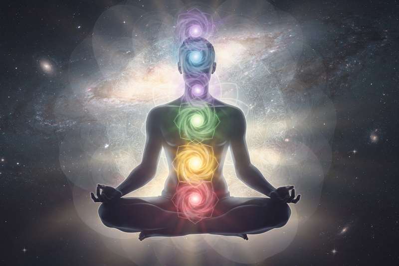 Seven polished gemstones arranged in order representing the root, sacral, solar plexus, heart, throat, third eye, and crown...