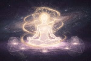 Serene person meditating in nature with glowing light around their head representing spiritual awakening.