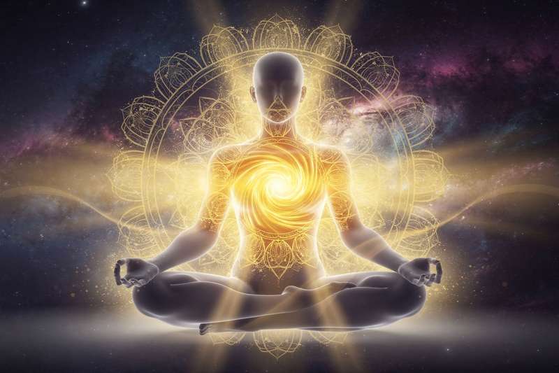 Yoga practitioner in warrior pose strengthening solar plexus chakra and personal power.