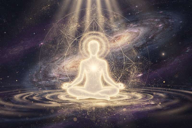 Person performing self-reiki hand placement on their own body to balance and heal personal energy flow.