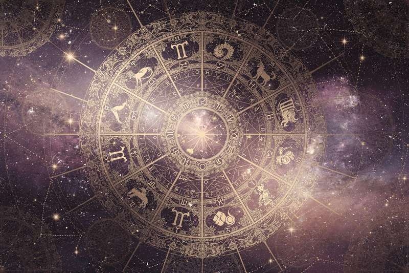 Astrological wheel showing zodiac symbols and planetary positions for April and May forecasts.