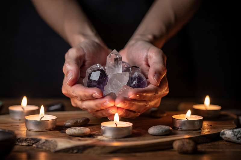Healing crystals arranged on a wooden surface for managing addiction and overcoming unwanted cravings naturally.