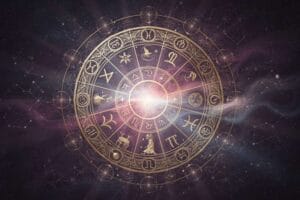 Libra man leaning forward with interest while talking to a woman at a social gathering.